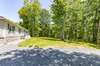 Front yard with trees for privacy from the road