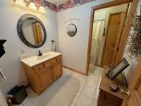 Bathroom upstairs has tiled flooring.