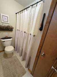 Shower/tub combination in upstairs Bath.