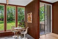 The inside and outside environments are connected throughout this home. The original floor to ceiling sliders are found in almost every room of this home, 9 in total. This one leads to a private back zen garden patio.