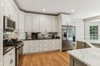 Gorgeous Backsplash, Ample Cabinets and Storage