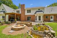 Patio, Covered Back Porch, Stone Firepit, and Koi Pond Installed in 2020, Providing the Most Tranquil Evenings!