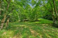 Enjoy Sledding? This Property Offers the Perfect Hill for Winter Fun!