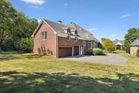 3 car w/ insulated garage doors and plenty of parking area in driveway