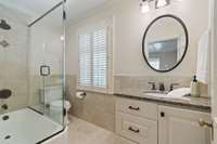 The bathroom at the top of the stairs shared by the two secondary bedrooms.