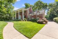 Beautiful well-kept aggregate driveway and walkways from the front yard to the back.