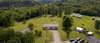 An aerial view of the lot and surrounding tree line.