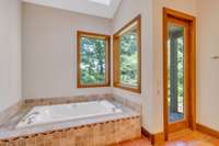 It also features a soaking tub and door to a private terrace.