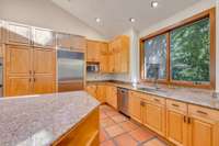 The kitchen is original to the house and features custom, solid wood cabinetry.