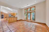 Gorgeous terracotta tile is featured throughout the common areas on the main level.