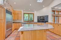 Another view of the kitchen showing the island seating area.