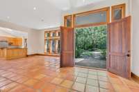 The solid wood double doors lead from the porch to the expansive foyer.