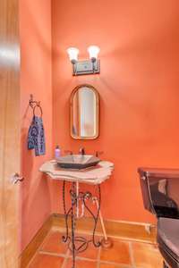 The powder room is conveniently located near the entryway and great room.