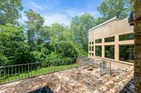 The patios and terraces wrap around the entire back of the house.