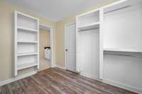 The primary closet is fantastic with custom built-in hanging racks and shelving.