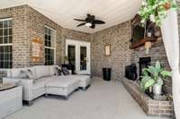 Covered back patio with wood-burning fireplace!