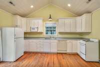 There's a full kitchen here in addition to the living space.