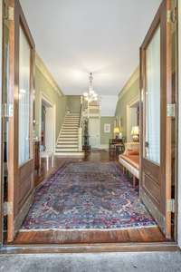 The extra-wide entry hearkens back to the days when the entries welcomed family and visitors in a grand way.