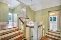 Make your way up the grand staircase to the 4 additional bedrooms on the second level.