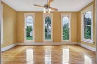 There are two more "flex" rooms adjacent to bedrooms on the upper level.  This room is located on the front of the home with charming arched windows.