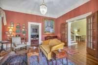 The hardwood floors, french door and detailed molding through the rooms make for a pleasing atmosphere in which to spend time.
