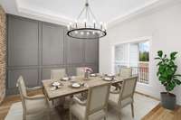 Virtually staged photo of the dining room shows how the space could be utilized with dining room furniture.