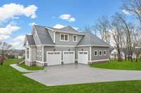 The oversized wide driveway adds tons of potential parking when entertaining or inviting guests at the home.  *Green grass was edited for MLS purposes.