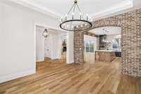 The solid white oak floors matched with this brick archway wall is absolutely stunning!