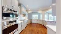 Double ovens, upgraded gas cooktop and cabinets galore!