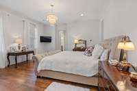 Enjoy this private Primary Bedroom suite with beautiful wood floors and exquisite fixtures