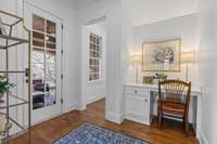 Just off the kitchen and primary bedroom is a sweet nook with built-in desk.