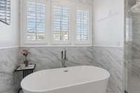 Stand alone tub with tile surround makes every weekend a joy!