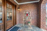 Inviting front porch with access to the open terrace to the left as you enter front door