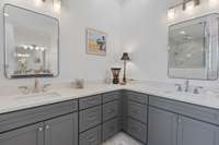 Renovated Primary bathroom suite with double vanities and quartz counter tops