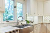 New dumbwaiter (located to the right of the sink) delivers groceries from the garage directly to the kitchen.