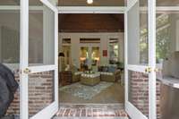 Looking into porch from the exterior back deck.