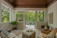 Brick flooring. Antique timbers. Mortar washed brick walls incorporates the outside in. Vaulted ceiling peaks around 17 ft with a ceiling fan.