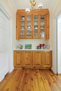 Handcrafted Butler's pantry-ideal for storage. Laundry room to right.