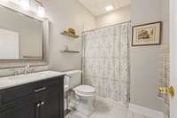 Full bath on the lower level. Shower only. Entry to lower level is directly from the garage or stairs from the kitchen.