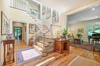 To the right of the foyer is the formal living room.  Down the hall on the way to the family room is a wet bar and powder room.