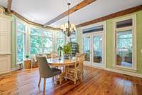 French doors lead to the screened-in porch.