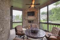 Screened in patio with fireplace