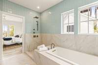 Featuring a luxurious soaking tub and a rainfall shower (with glass installation coming soon).