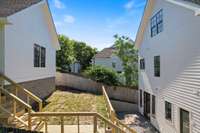 The urban patio provides generous space for outdoor gatherings between the home and detached garage. The first level includes a private pea graveled area while the second level offers a grassy area, perfect for your dog or a fire pit.