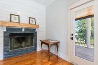 Bedroom 4 with fireplace and door leading to balcony