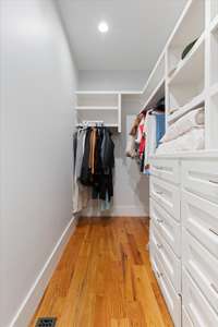 Pimary walk-in closet with built-ins