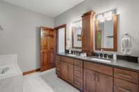 Primary bathroom has double sinks, large soaking tub, large walk-in shower and spacious closet.