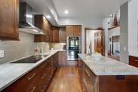 Gourmet kitchen with induction cooktop, double ovens and a large walk-in pantry.