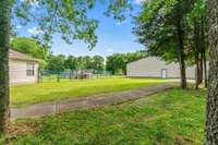 Lots of backyard with mature trees