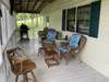 Great seating area on the side porch directly off of the mud room from the side door